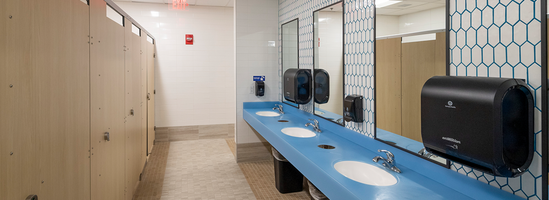 Locker Room with shower stalls and sinks