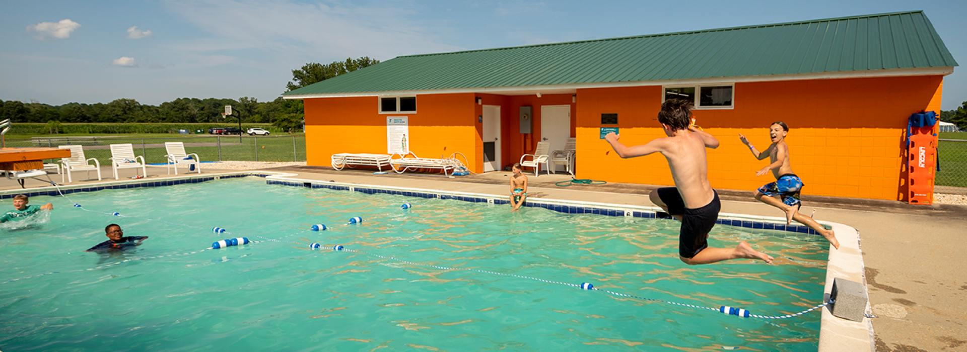 Kids jumping into the pool