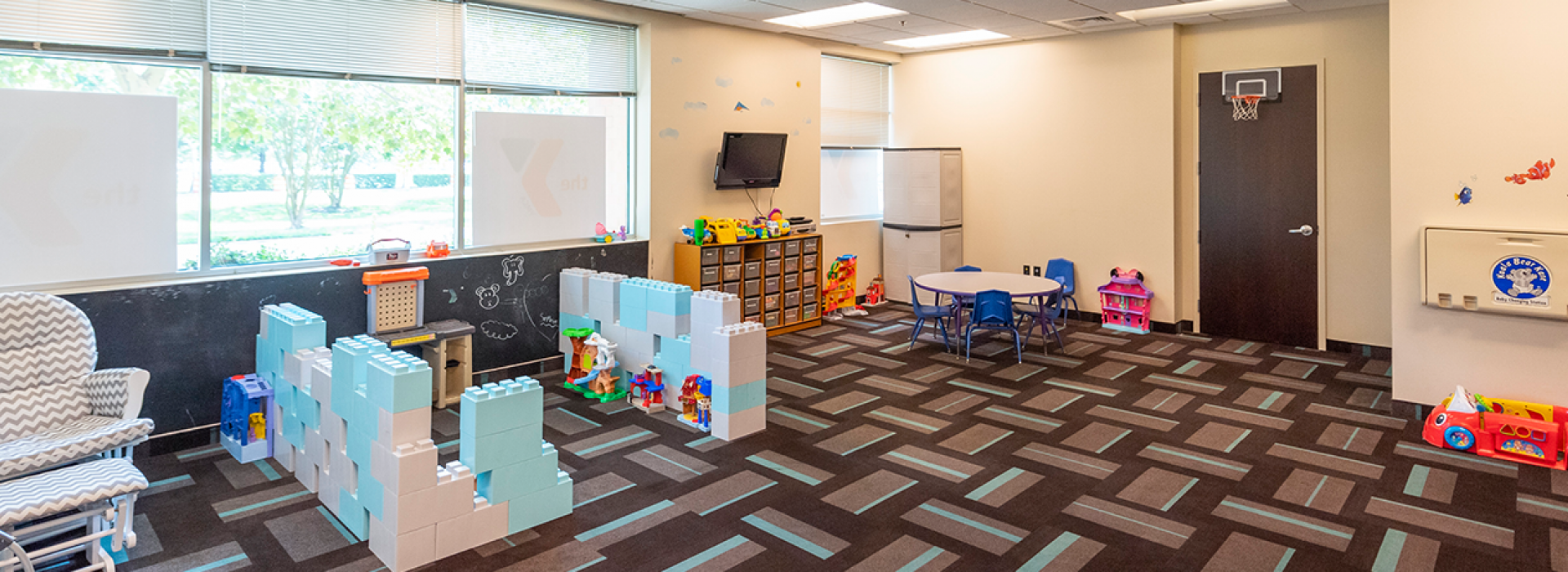 Child Watch area with toys for kids to play with